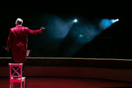 man in red coat