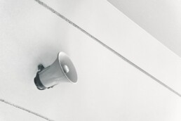 gray megaphone on white surface